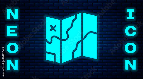 Glowing neon Folded map icon isolated on brick wall background. Vector.