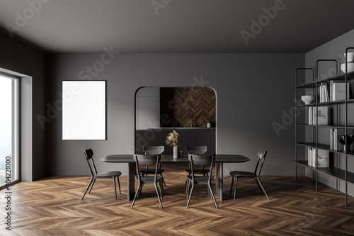 Gray kitchen interior with table and poster