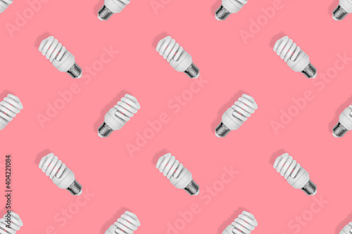 Light bulb seamless pattern. Lighting bulbs on a red background.