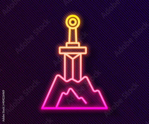 Glowing neon line Sword in the stone icon isolated on black background. Excalibur the sword in the stone from the Arthurian legends. Vector.