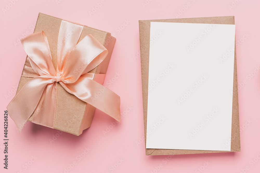Gifts with note letter on isolated pink background, love and valentine concept Gifts with note letter on isolated pink background, love and valentine concept