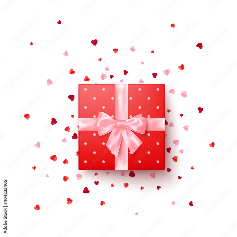 Fototapeta premium Realistic red gift box with pink silk bow decorated confetti top view. Vector illustration