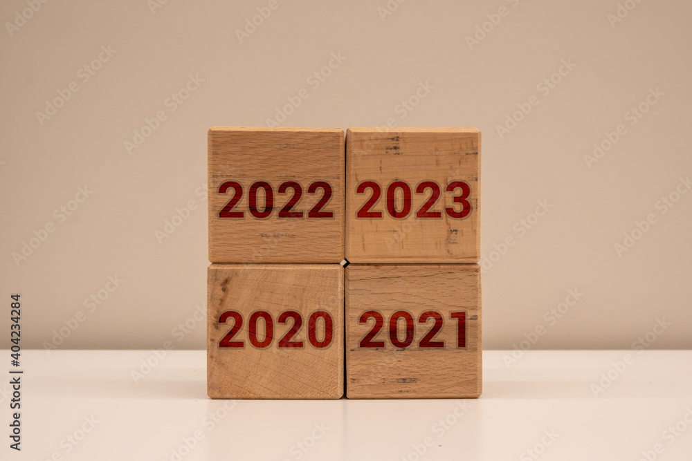 Years written on wooden blocks. The years 2020, 2021, 2022, 2023. The concept created from wooden cubes for years. Years written on wooden blocks. The years 2020, 2021, 2022, 2023. The concept created from wooden cubes for years.