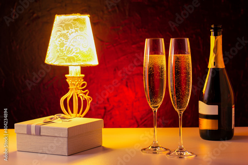 Romantic luxury evening with champagne and gift. Valentines Day.