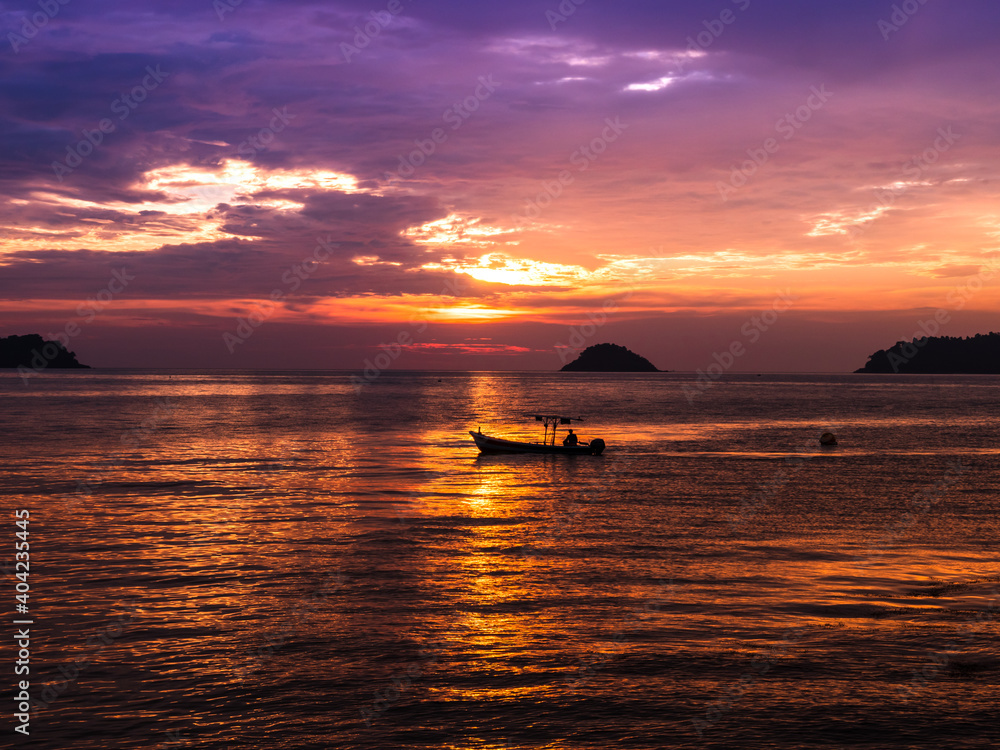 The beautiful lights of the sunset on the sea, make you feel relaxed and calm.