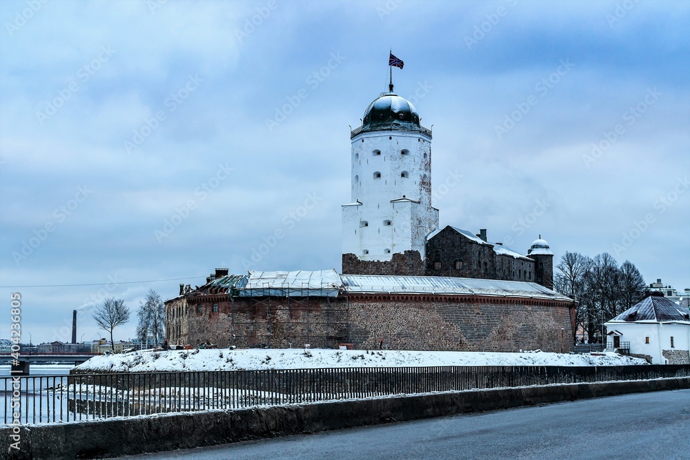 Russia, Vyborg, January 2021. Panorama of the castle from the bridge over the bay.