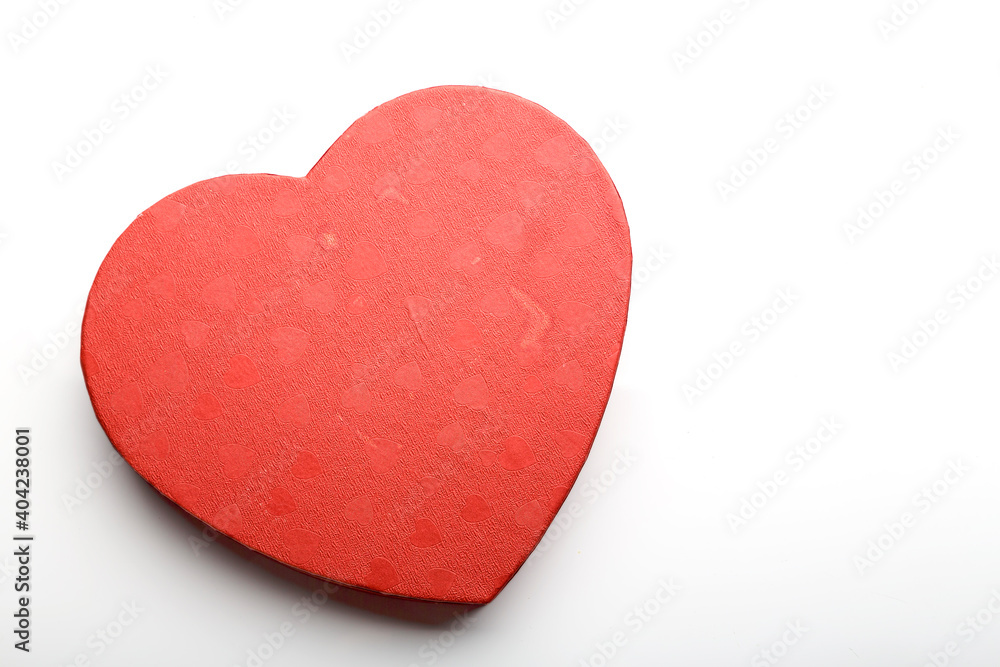 Fototapeta premium Red heart made of cardboard for Valentine's day on a white background.