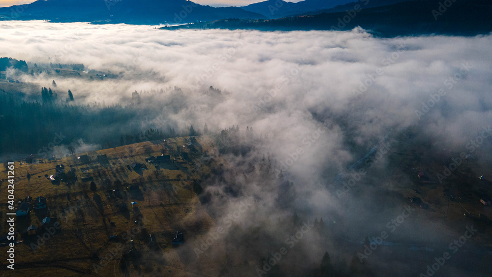 mountains tops high above clouds fog