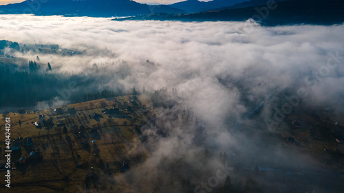 Fototapeta Naklejka Na Ścianę i Meble -  mountains tops high above clouds fog