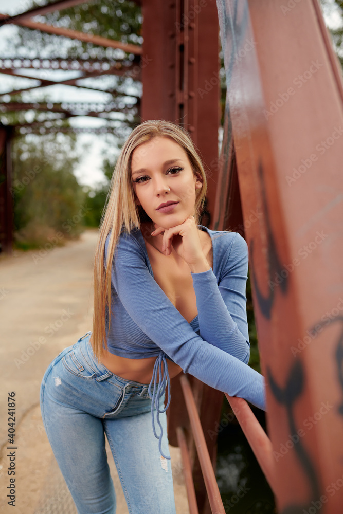 Fototapeta premium woman, young, fashion, beauty, beautiful, dress, model, street, person, city, people, urban, cute, outdoors, portrait, one, lady, hair, happy, white, jeans, park, smile, summer, walking