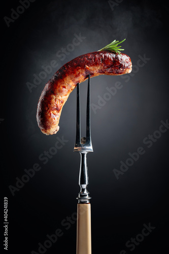 Grilled Bavarian sausage with rosemary.
