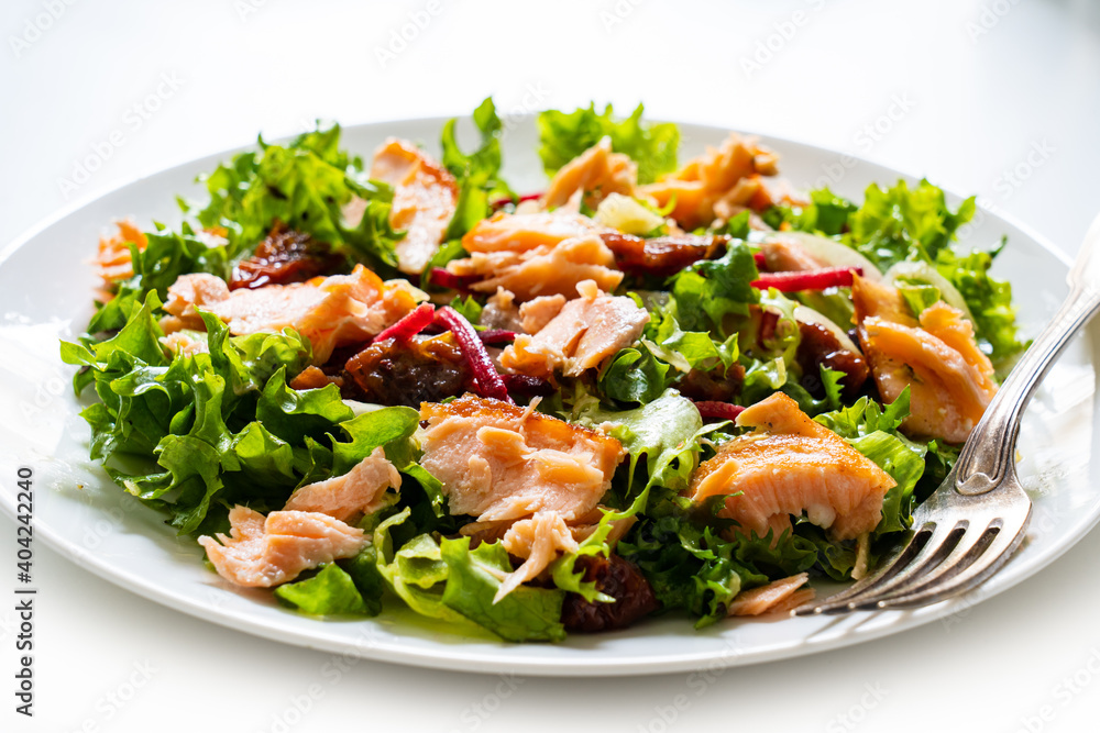 Salmon salad - roasted salmon with mix of vegetables on white background
Salmon salad - roasted salmon with mix of vegetables on white background