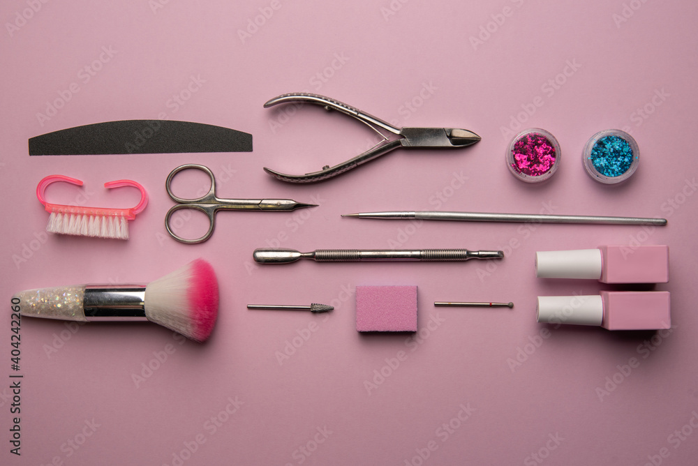 Set of manicure tools and accessories on a pink background. Hardware manicure,Flat lay. Set of manicure tools and accessories on a pink background. Hardware manicure,Flat lay.
