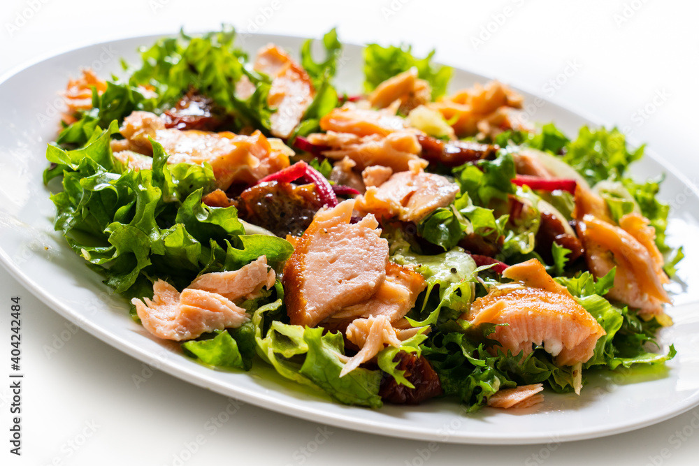Salmon salad - roasted salmon with mix of vegetables on white background
Salmon salad - roasted salmon with mix of vegetables on white background
