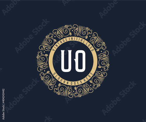 Initial UO Antique retro luxury victorian calligraphic emblem logo with ornamental frame. photo