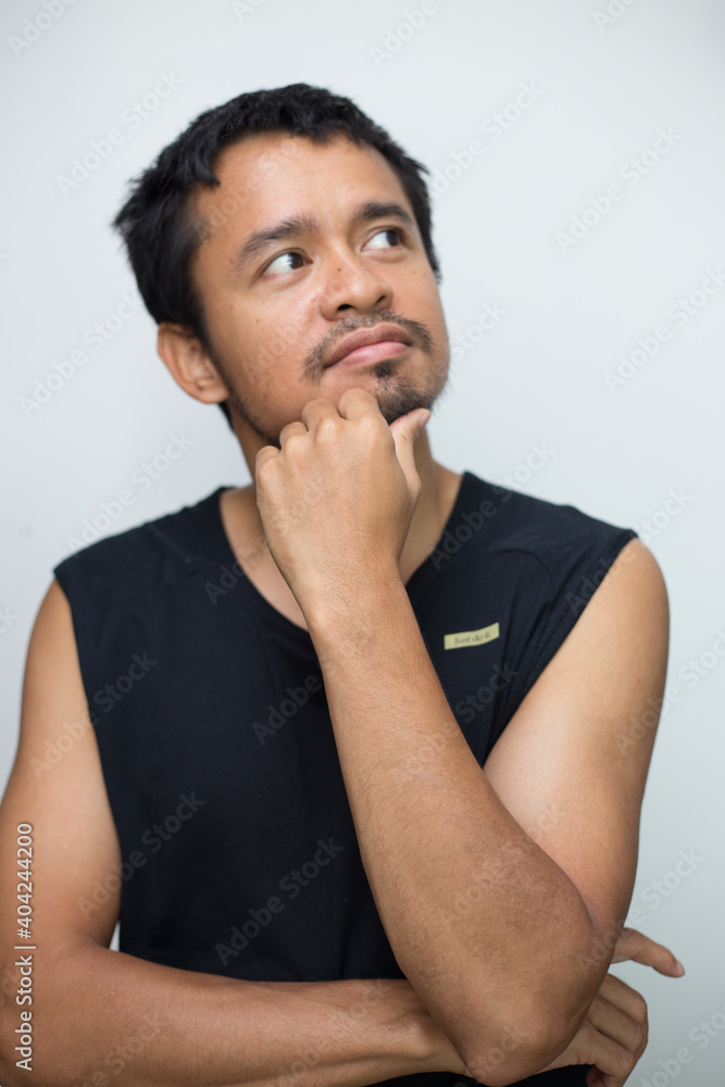 Portrait of handsome beard asian young thoughtful man Portrait of handsome beard asian young thoughtful man