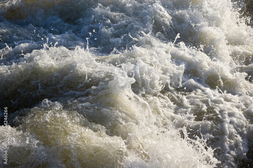 Churning white water river rapids Churning white water river rapids
