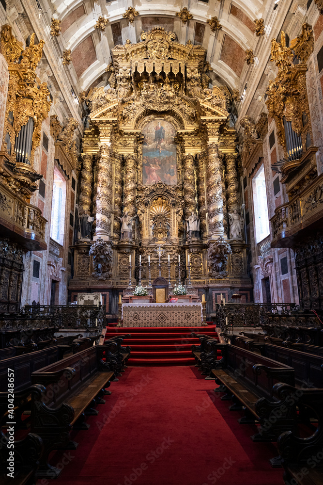 Interior of Porto Cathedral, medieval building. Red carpet.