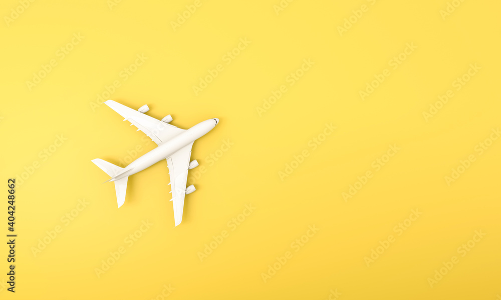 White plane on yellow background. Flat lay of travel concept. White plane on yellow background. Flat lay of travel concept.