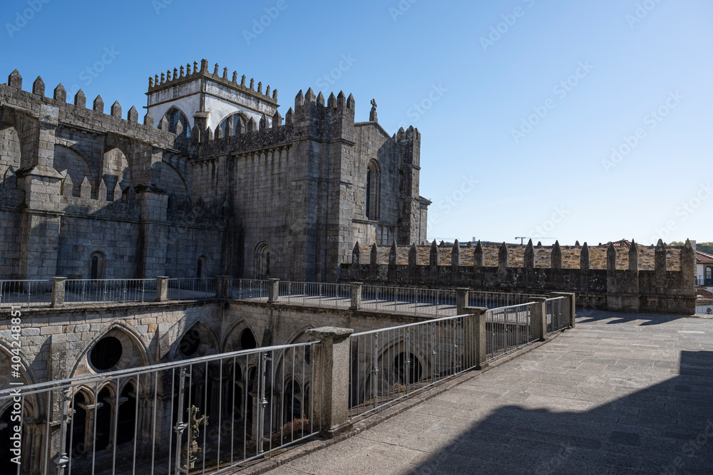 Obraz premium Porto cathedral seen from the inner courtyard. Building made of stone Blue sky.