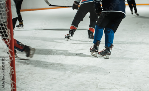 People play hockey outdoors in winter time.