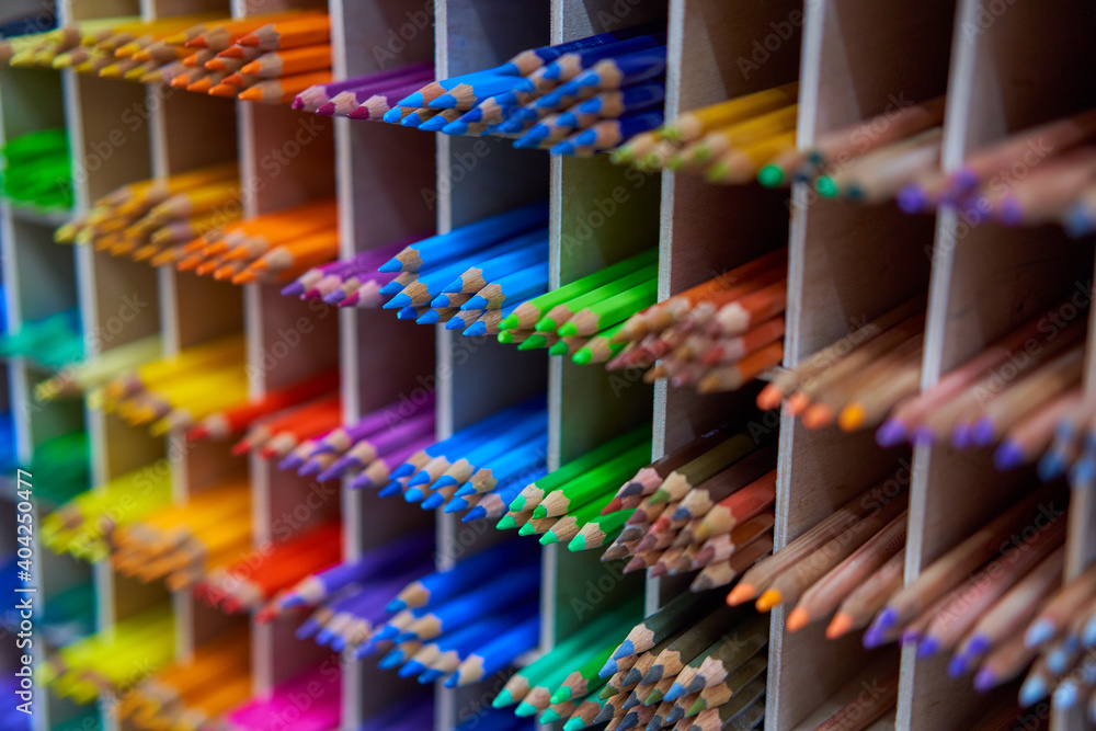 Showcase with colored pencils for drawing in the store for artists or stationery