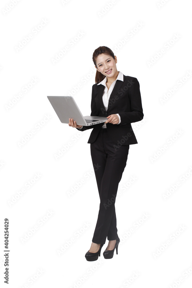 A happy young Business woman holding laptop A happy young Business woman holding laptop