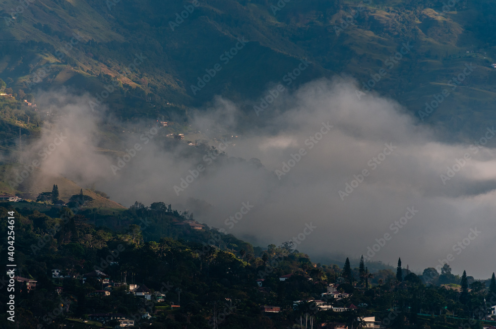 
Colombian green mountains among the clouds at sunrise. Medellin, Colomia. January 10, 2021