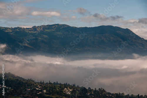 
Colombian green mountains among the clouds at sunrise. Medellin, Colomia. January 10, 2021 photo