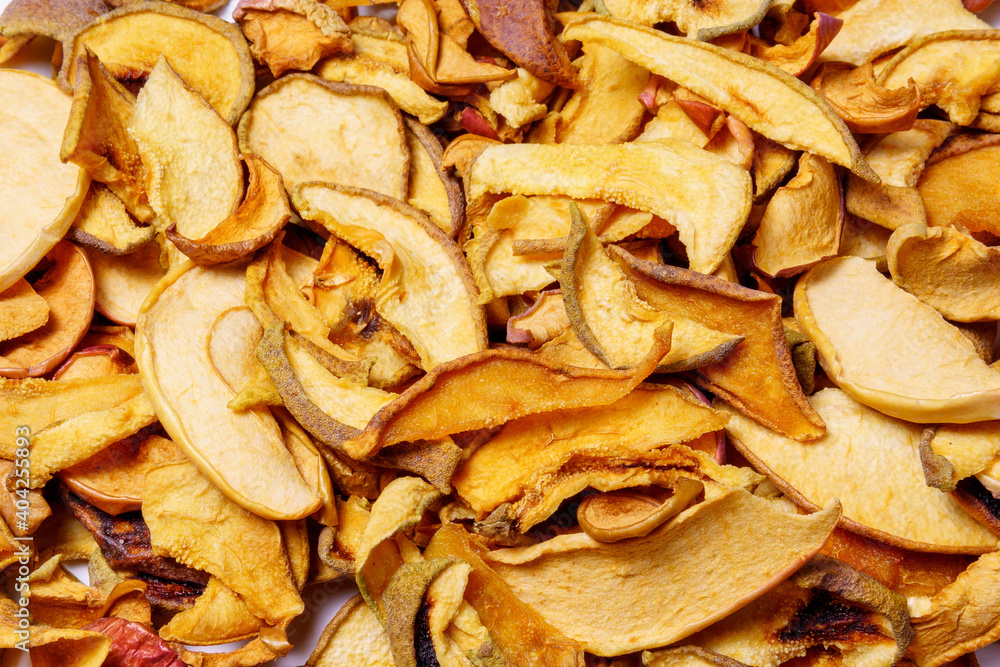 Dried apples background. chopped dried apples. natural background. Dried fruits concept of crop preservation, harvesting. Dried apples background. chopped dried apples. natural background. Dried fruits concept of crop preservation, harvesting.