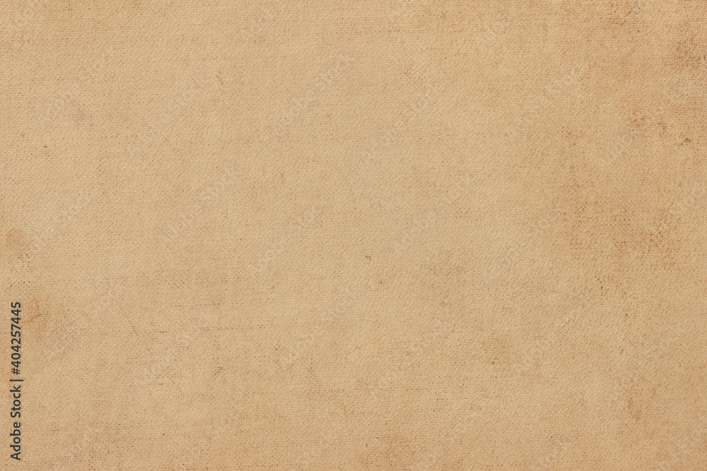 The surface of the old worn faded cardboard is stained. The surface of the old worn faded cardboard is stained.