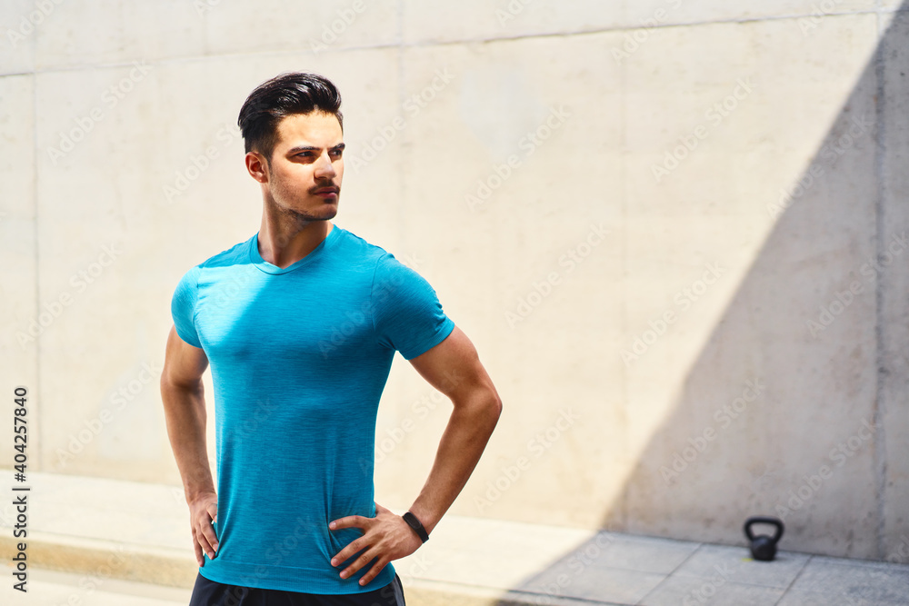 Athletic man getting ready for outdoors exercise Athletic man getting ready for outdoors exercise