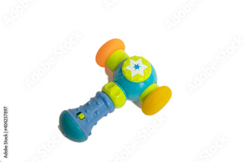 Blue plastic toy hammer, kid workshop game tool. Isolated on white background.