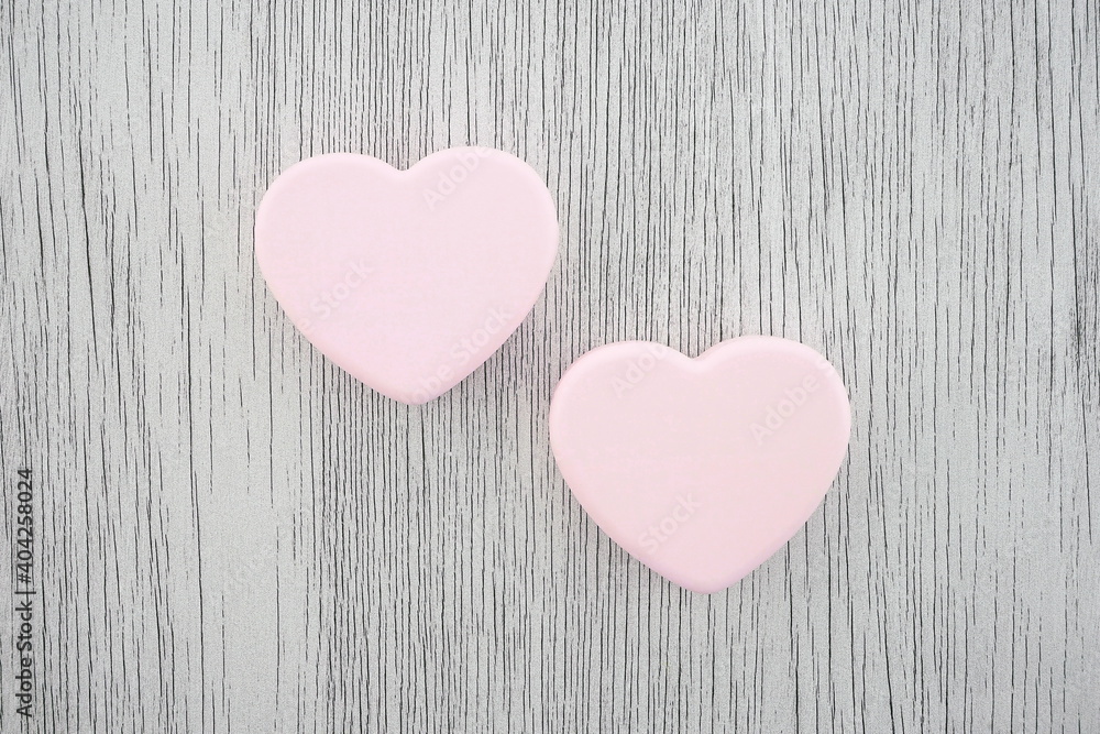 Pink heart on a gray background. Composition for Valentine's Day. Top view, copy space, flat lay. Pink heart on a gray background. Composition for Valentine's Day. Top view, copy space, flat lay.