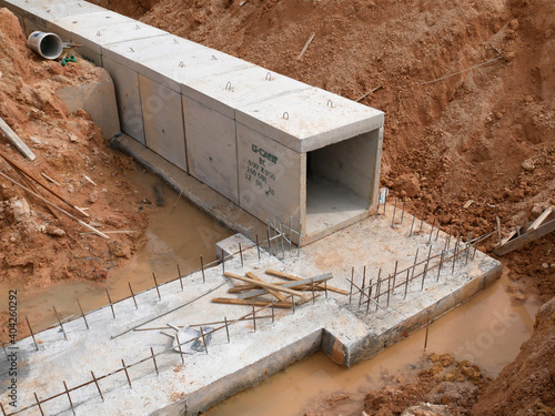 SELANGOR, MALAYSIA -JANUARY 19, 2020: Underground precast concrete box culvert drain under construction at the construction site. It is used to channel stormwater to the nearest monsoon drain.  photo