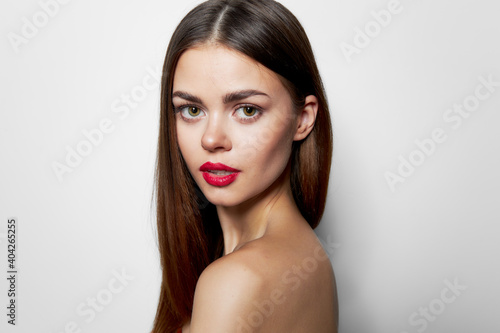 Woman with bare shoulders Confident look beautiful face charming look 