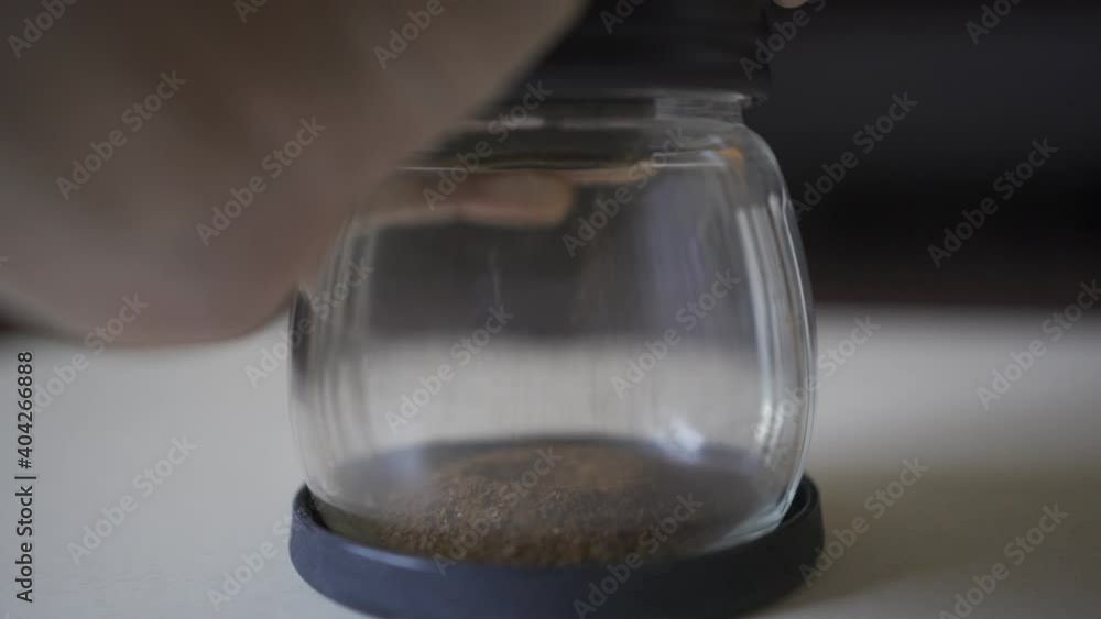 Grinding coffee beans with manual grinder Grinding coffee beans with manual grinder