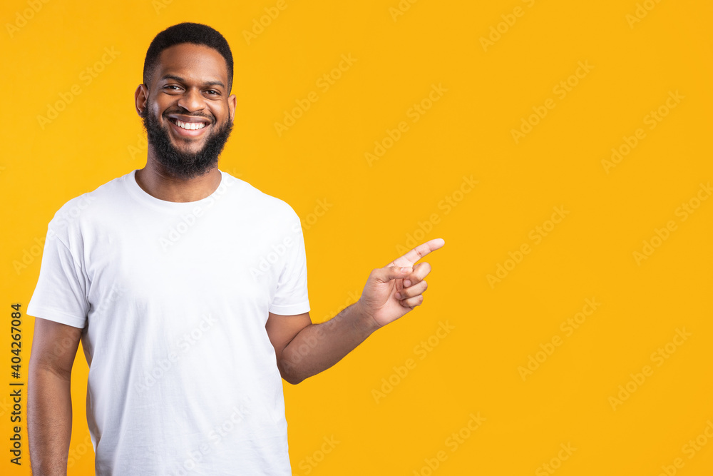 Black Man Pointing Finger Aside Standing Over Yellow Studio Background Black Man Pointing Finger Aside Standing Over Yellow Studio Background