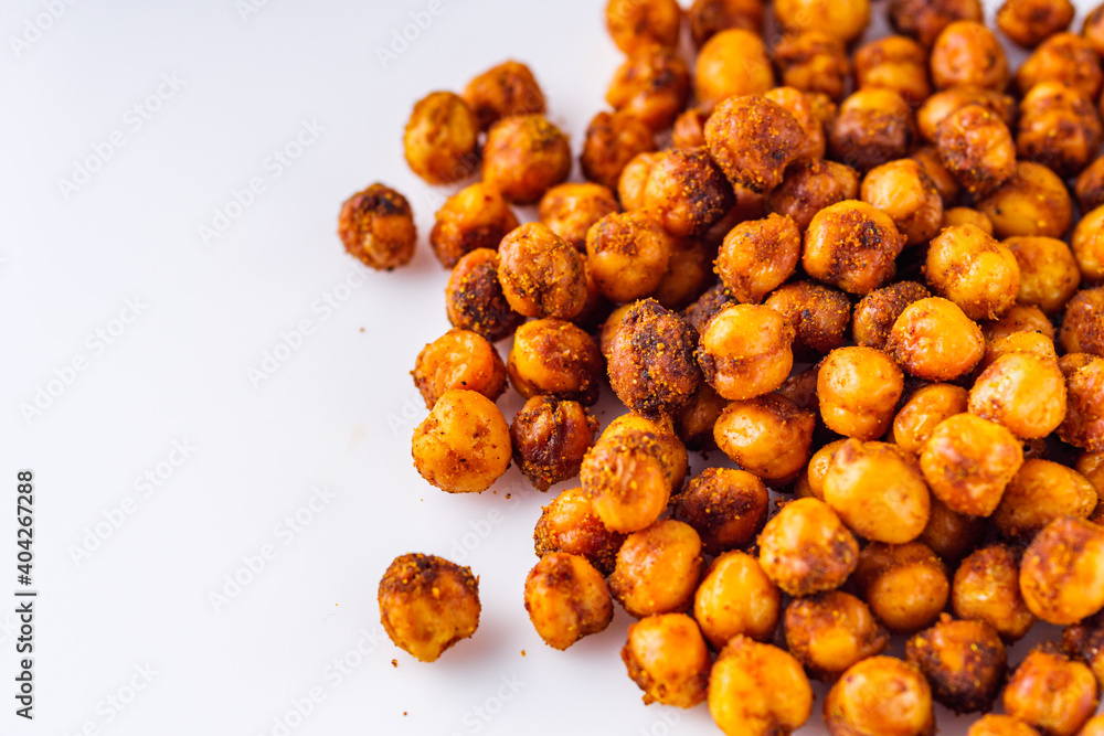 fried chickpeas on a white acrylic background fried chickpeas on a white acrylic background