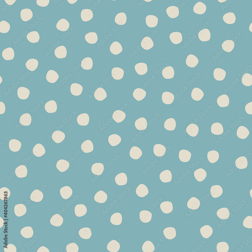 Seamless hand drawn polka-dot pattern on blue background for surface design and other design projects