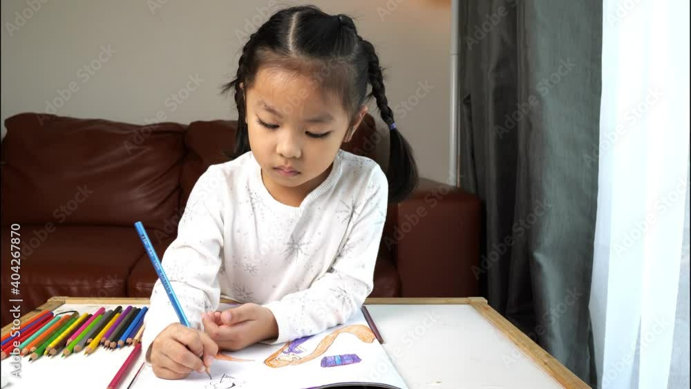 Asian girl doing homework study from home Asian girl doing homework study from home