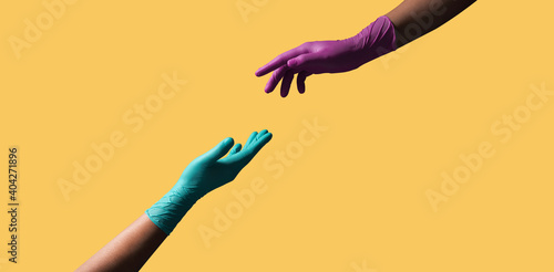 Love and Relationship during Coronavirus Concept. Two Hands with Medical Glove try to Touching Closer. Floating over Colorful Pop Color background