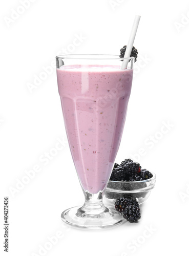 Tasty fresh milk shake and blackberries on white background