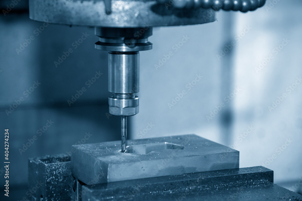 The CNC milling machine cutting the mold parts by solid ball end-mill tool. The hi-precision mold and die manufacturing concept by machining center. The CNC milling machine cutting the mold parts by solid ball end-mill tool. The hi-precision mold and die manufacturing concept by machining center.
