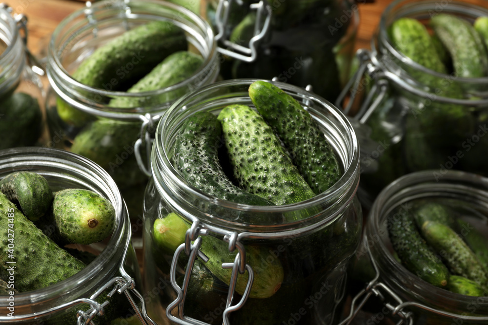 Pickling jars with fresh cucumbers, closeup view Pickling jars with fresh cucumbers, closeup view
