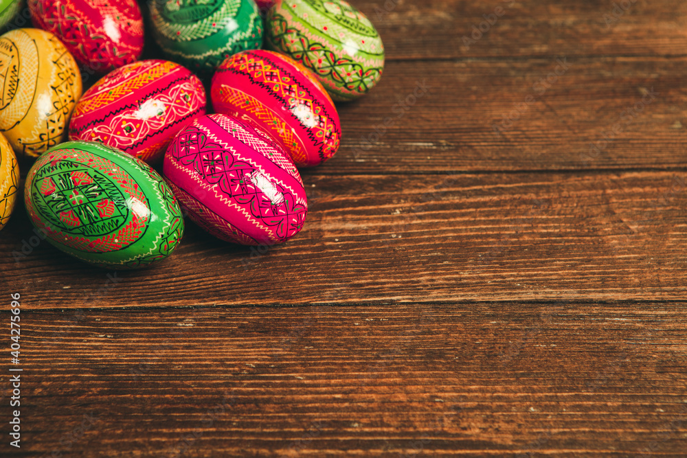 Colorful Easter eggs on wooden background. Happy Easter. Space for text. Colorful Easter eggs on wooden background. Happy Easter. Space for text.
