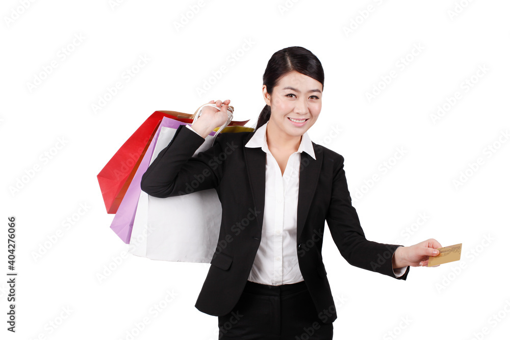 Businesswoman holding credit card and shopping bag Businesswoman holding credit card and shopping bag