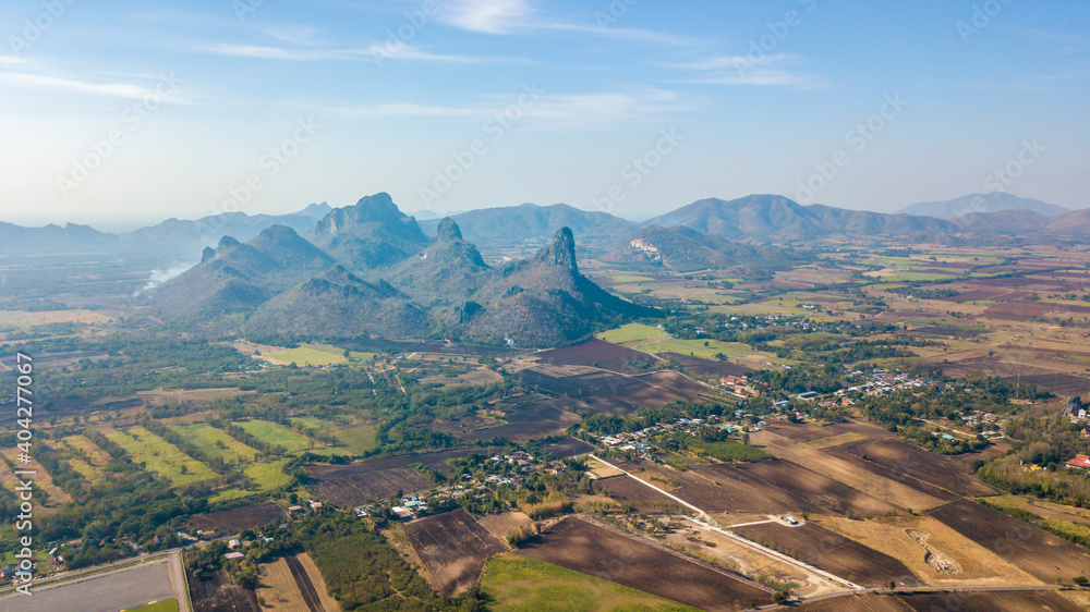 Aerial view mountain and agriculture area for sunflower plantation at Lopburi THAILAND