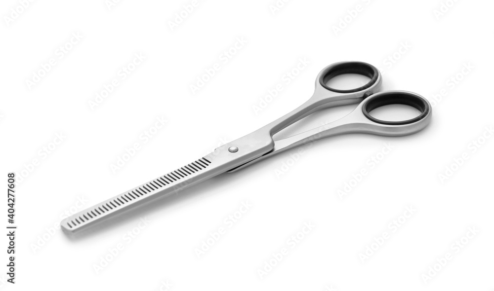 New thinning scissors isolated on white. Professional hairdresser tool New thinning scissors isolated on white. Professional hairdresser tool