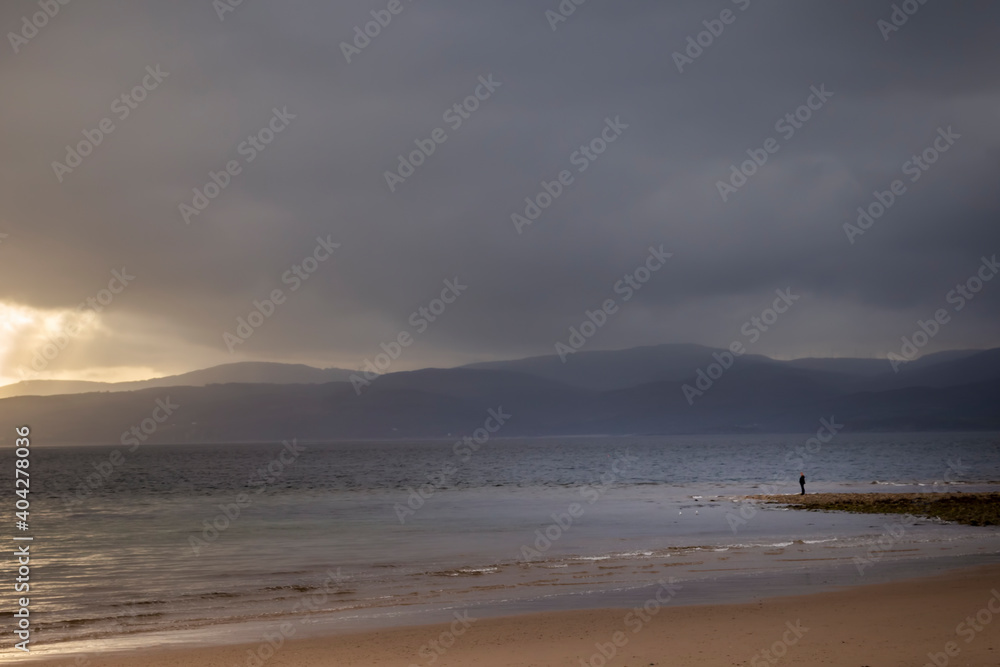 man standing on the beach on Arran